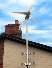 Domestic wind turbine mast mounted on the side of a house